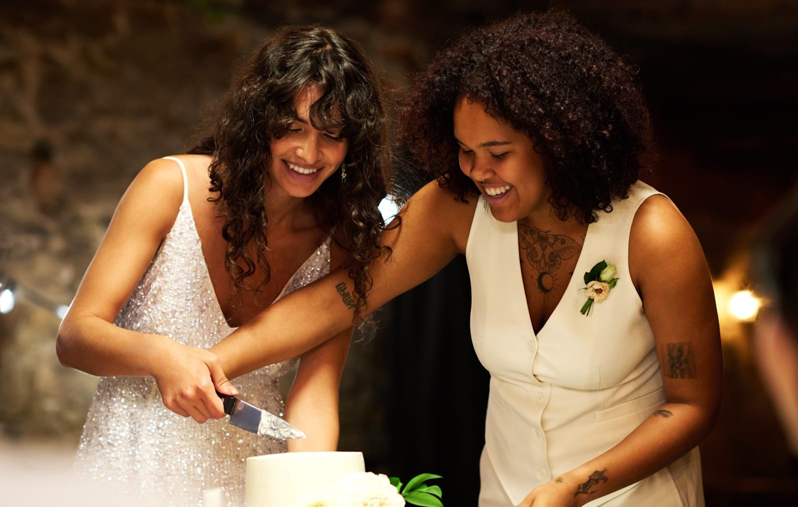 Happy couple cutting cake