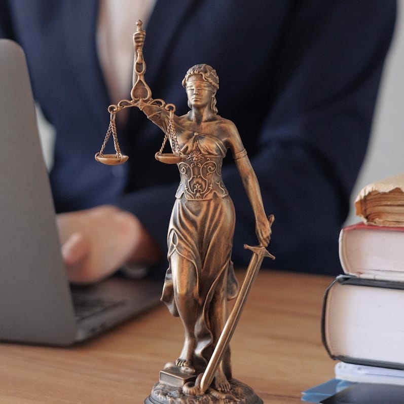 Lady justice on top of a desk